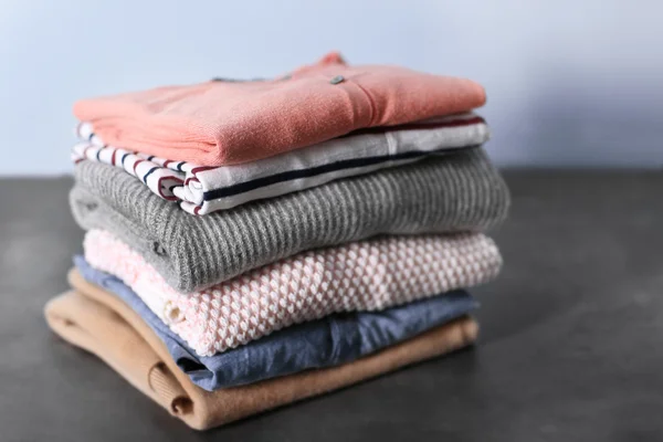 Pile of clothes on table — Stock Photo, Image