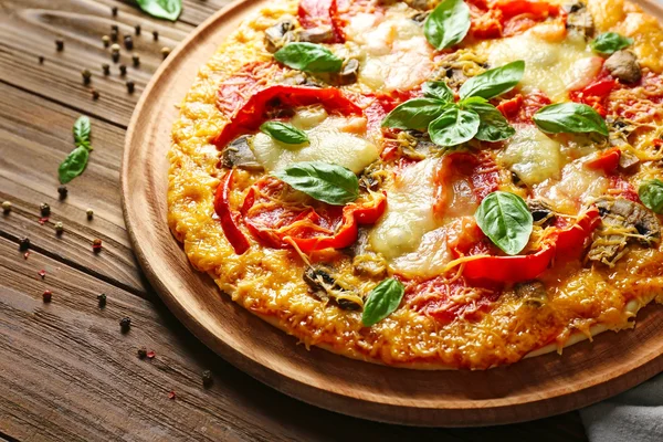 Tasty pizza on table — Stock Photo, Image