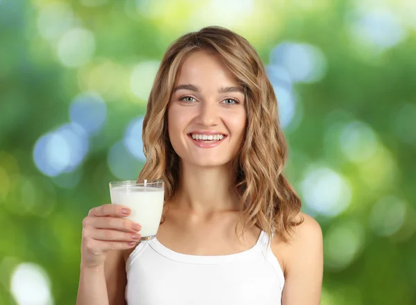 Woman with glass of milk Stock Photo