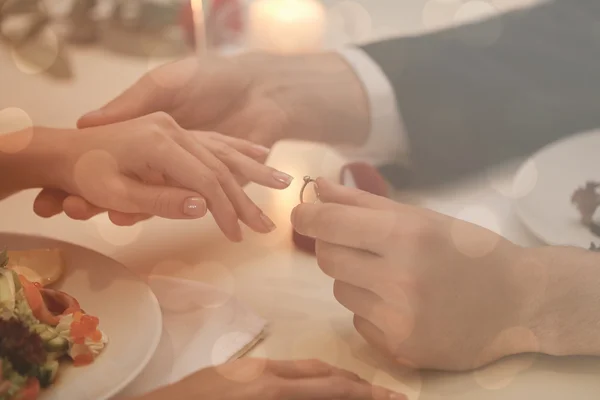 Man making marriage proposal to girlfriend at restaurant, closeup — Stock Photo, Image