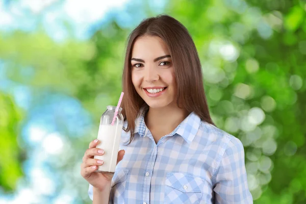 Young Woman Glass Bottle Milk Green Blurred Background — Stock Photo, Image