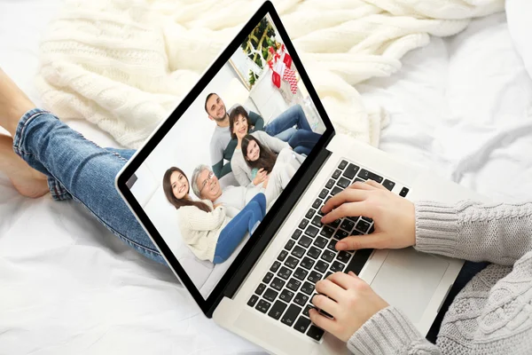 Woman video conferencing with family on laptop, Video call and chat concept