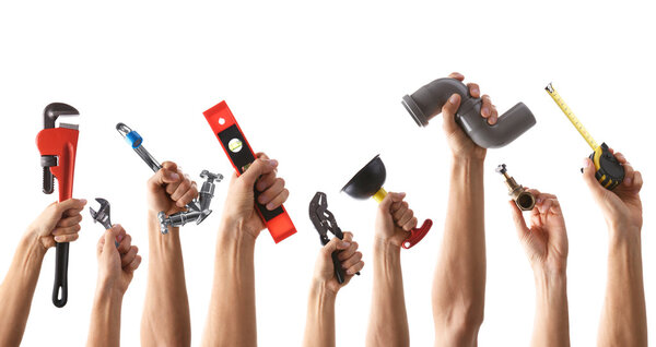 Set of male hands holding plumbing equipment on white background. Repair and maintenance concept.