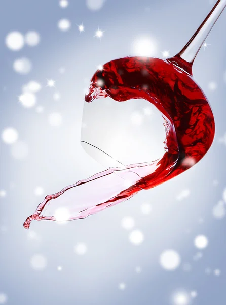 Glass of red wine with splash on light background, closeup. Christmas celebration concept. — Stock Photo, Image