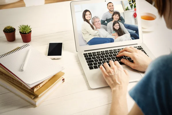 Woman video conferencing with family on laptop, Video call and chat concept