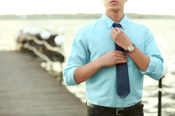 Businessman Adjusting Tie Pier Sunny Day — Stock Photo, Image