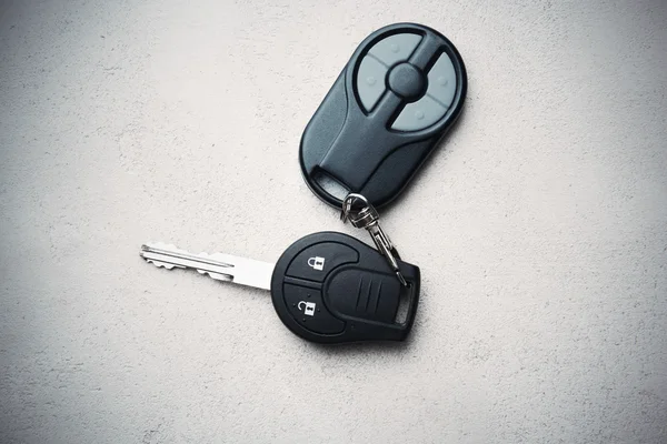 Car key on grey textured background — Stock Photo, Image