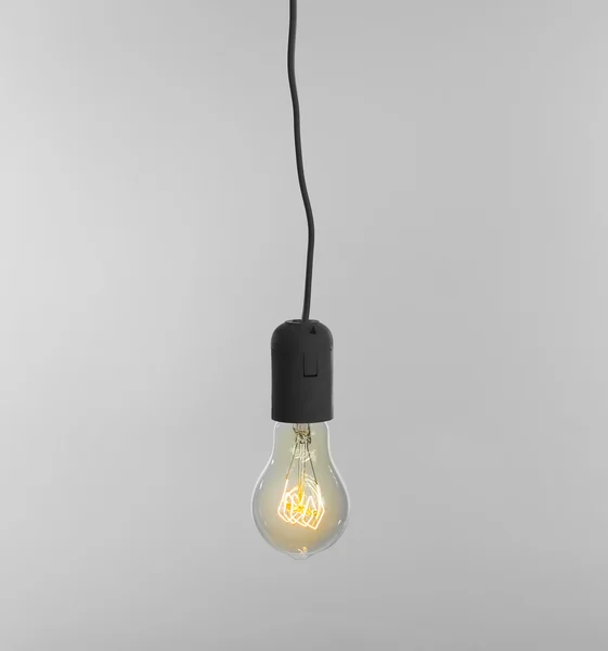 Light bulb on light background — Stock Photo, Image