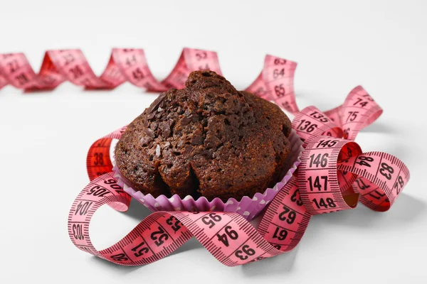Chocolate muffin with centimeter — Stock Photo, Image