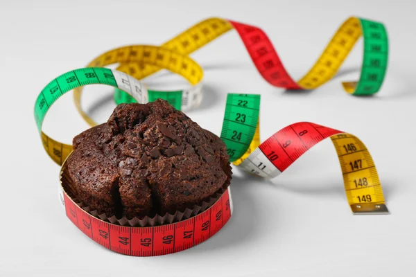 Chocolate muffin with centimeter — Stock Photo, Image