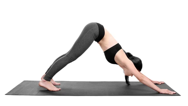 Young girl doing yoga exercises, isolated on white — Stock Photo, Image