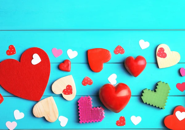 Decorative hearts on wooden background — Stock Photo, Image