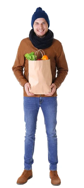 Joven con bolsa de comida aislada en blanco —  Fotos de Stock