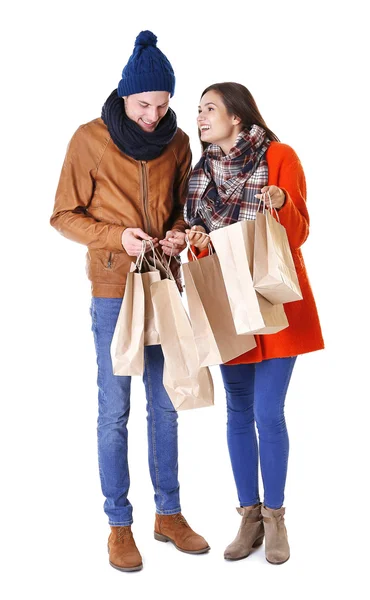 Happy couple with purchase isolated on white — Stock Photo, Image