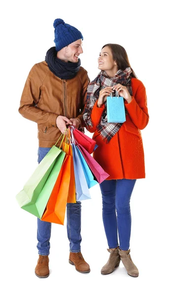 Happy couple with purchases isolated on white — Stock Photo, Image