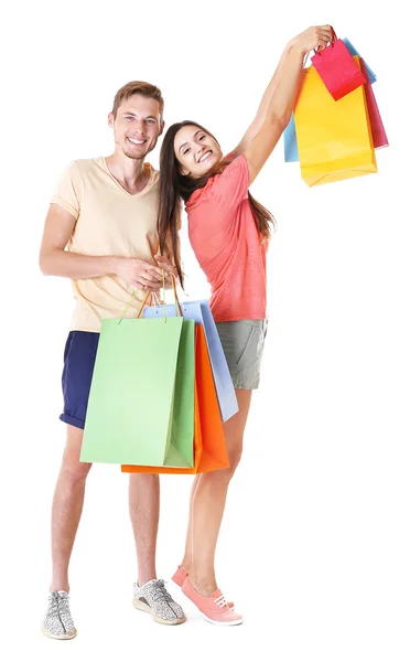 Casal feliz com compras isoladas em branco — Fotografia de Stock