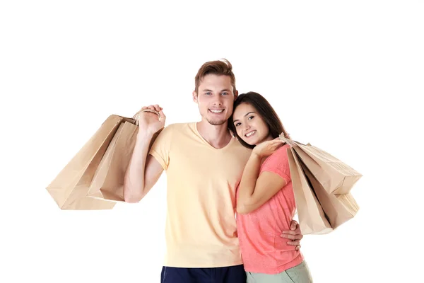 Lyckliga par med inköp isolerad på vit — Stockfoto