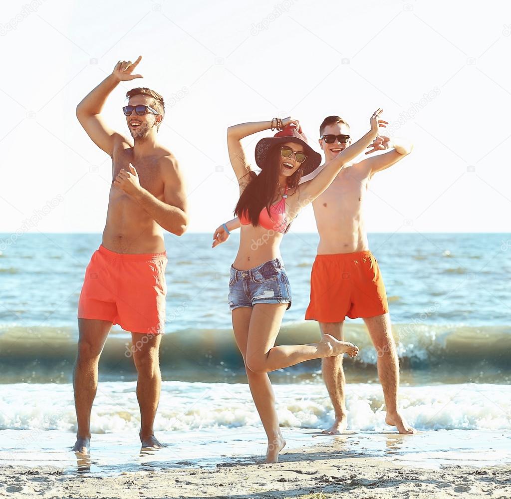 friends having fun on beach 