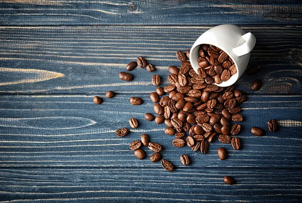 Cup with coffee beans — Stock Photo, Image