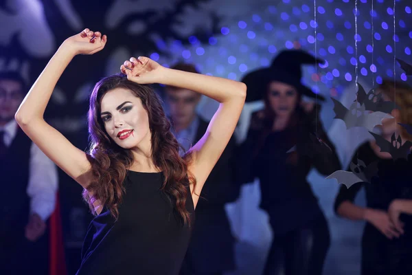 Young woman dressed as vampire at Halloween party — Stock Photo, Image