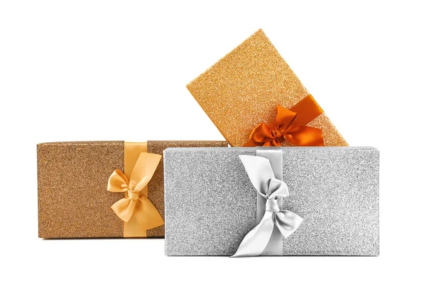Christmas gifts in shining boxes isolated on white — ストック写真