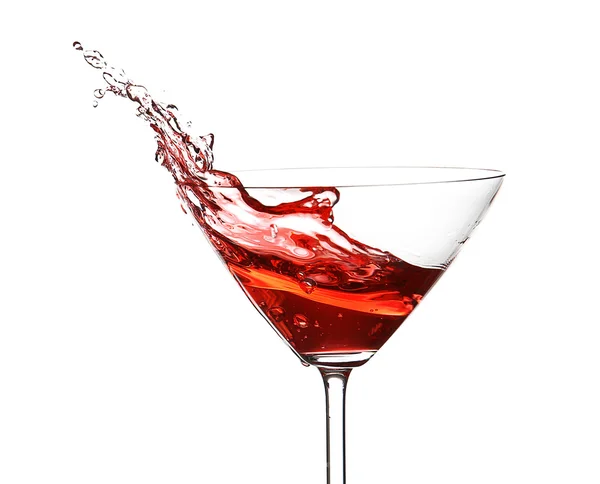 Red cocktail with splash on white background Stock Picture