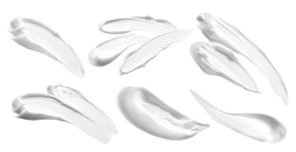 Beauty cream samples on white background.