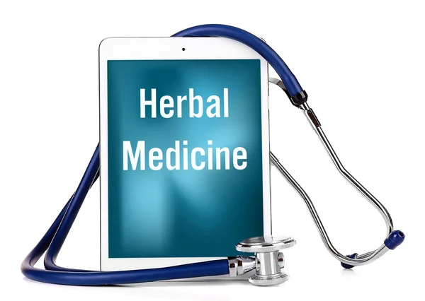 Stethoscope and tablet with text HERBAL MEDICINE on screen. Alternative medicine concept. — Stock Photo, Image