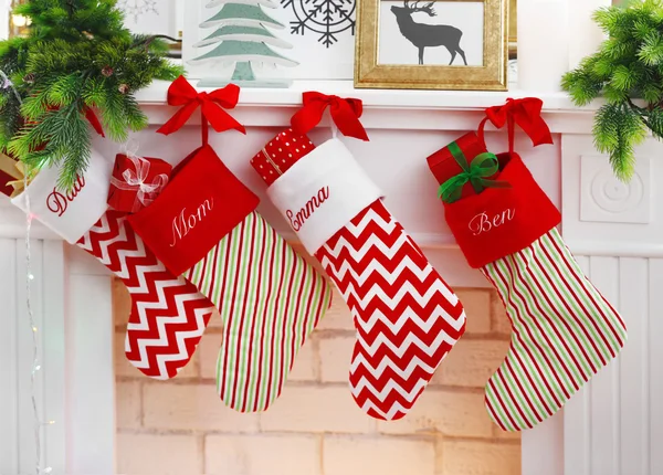 Fireplace with stocking decorated for Christmas, close up view — Stock Photo, Image
