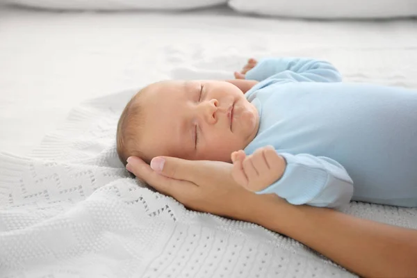 Mother hand touching cute sleeping baby, close up view — Stock Photo, Image