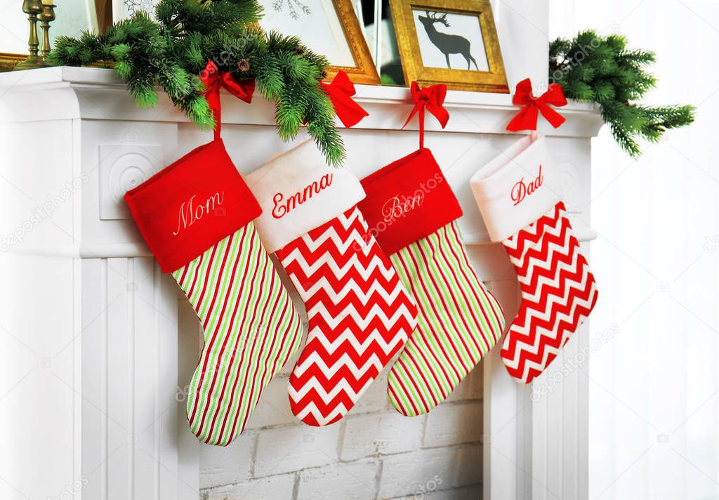 Stockings hanging on fireplace decorated for Christmas