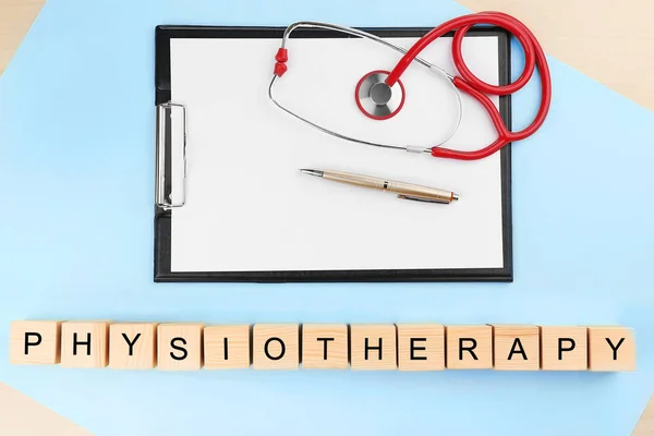 Word physiotherapy and stethoscope on folder, top view — Stock Photo, Image