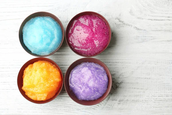 Body scrubs on wooden background — Stock Photo, Image