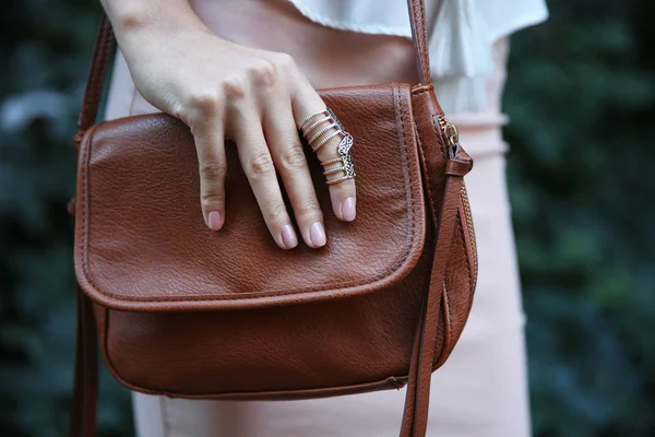 Female hand with bag and stylish ring, closeup — Stock Photo, Image