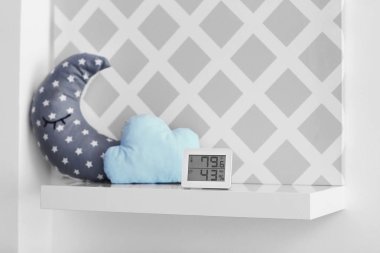 Digital temperature and humidity control in baby room clipart