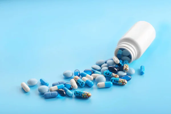 Heap of pills on blue background — Stock Photo, Image