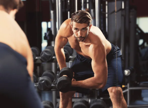 Man training with dumbbell in gym — Stock Photo, Image