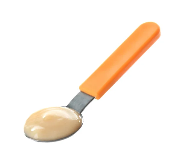 Bright spoon with baby puree on white background — Stock Photo, Image