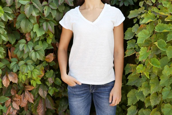 Girl on green leaves background — Stock Photo, Image