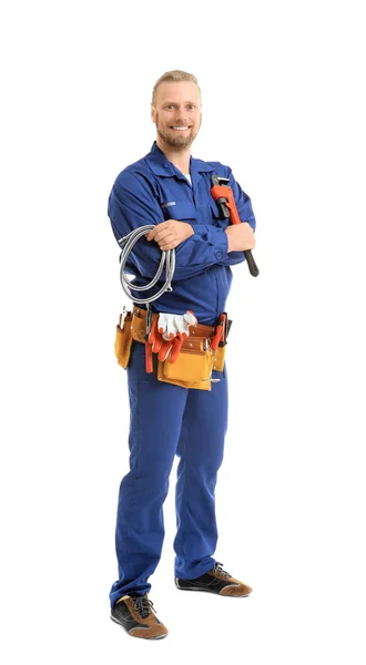 Handsome plumber with pipe wrench and flexible hose isolated on white — Stock Photo, Image