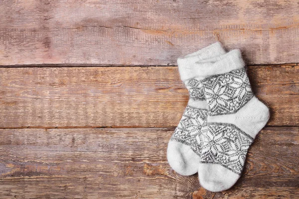 Winter socks on wooden background