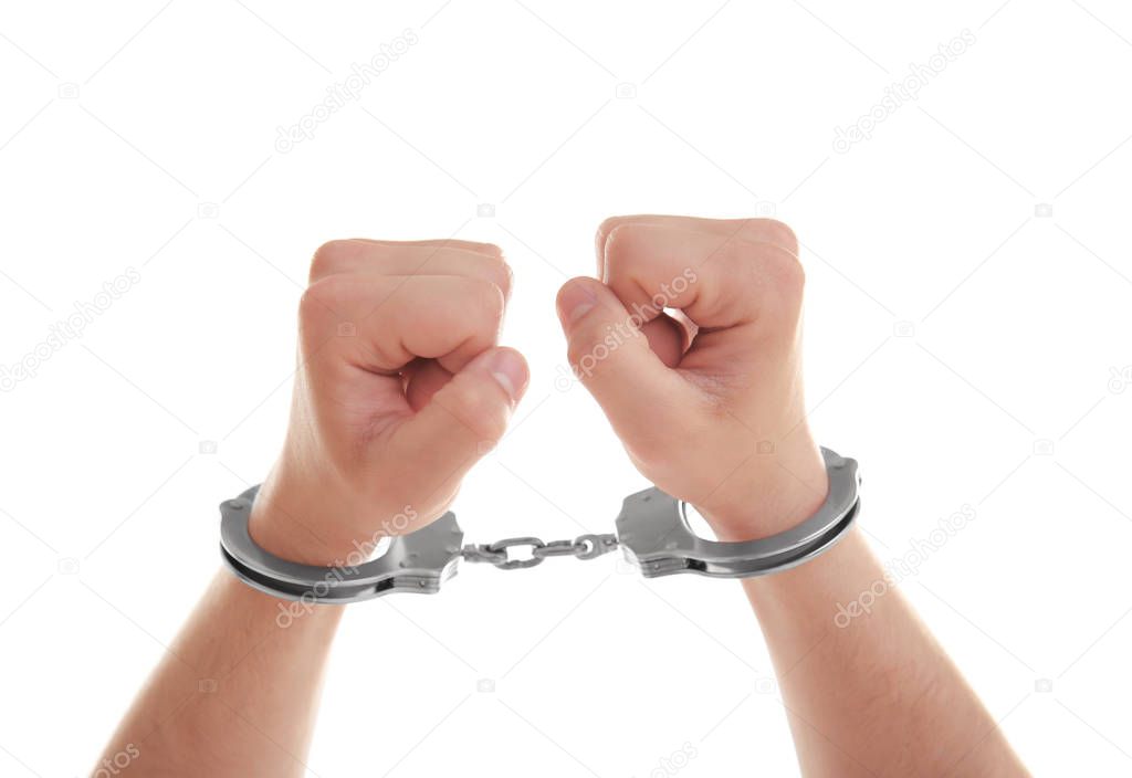 Man hands in handcuffs, isolated on white