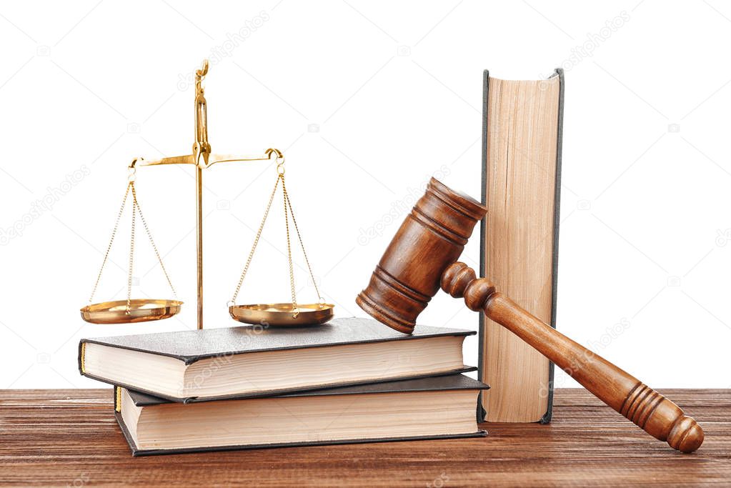 Gavel with books and scales on white background
