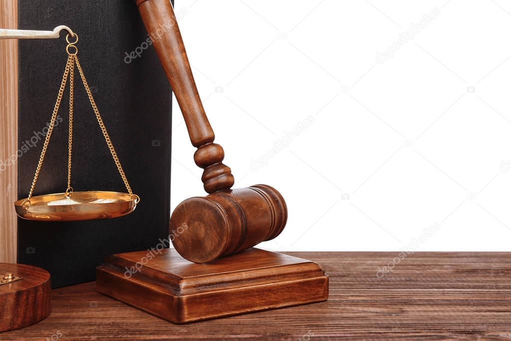 Gavel with book and scales on white background
