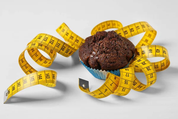 Chocolate muffin with centimeter — Stock Photo, Image