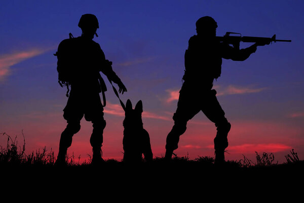 Silhouettes of soldiers and dog