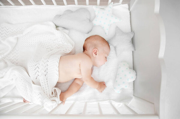 Little baby sleeping in crib  