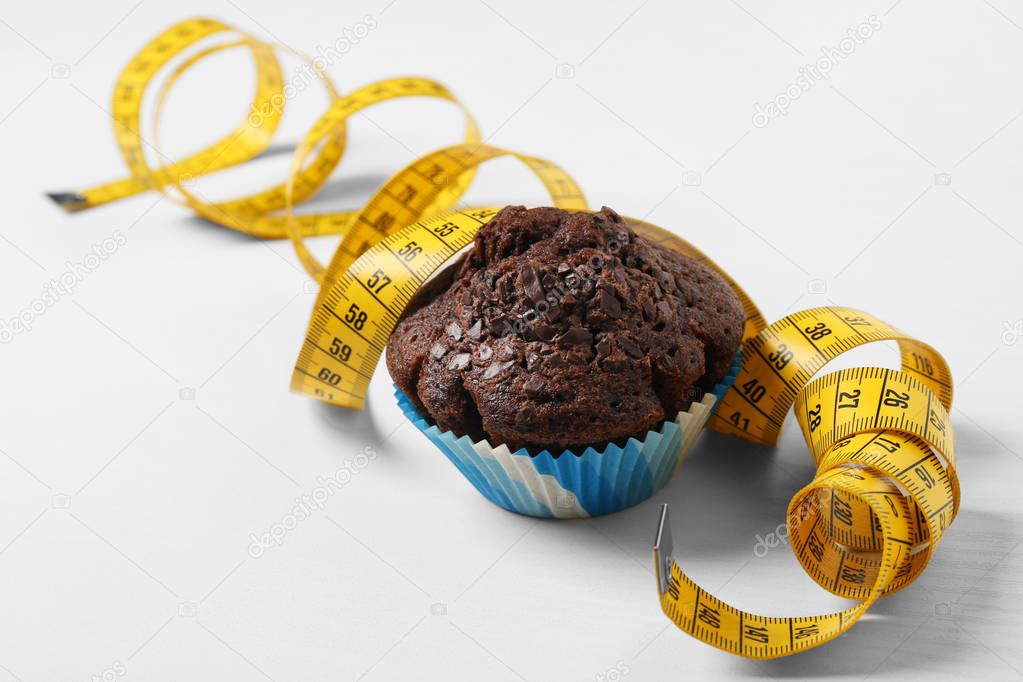Chocolate muffin with centimeter