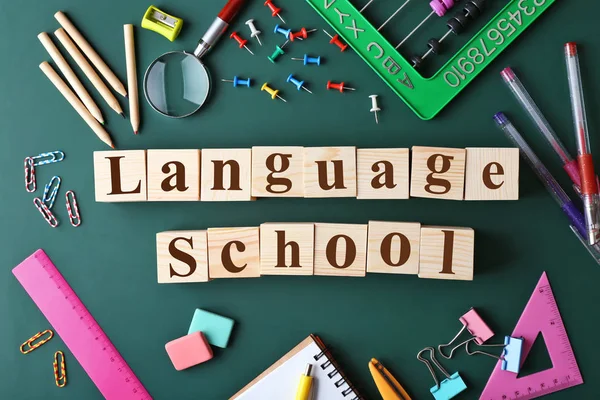 Colourful stationery and words LANGUAGE SCHOOL — Stock Photo, Image