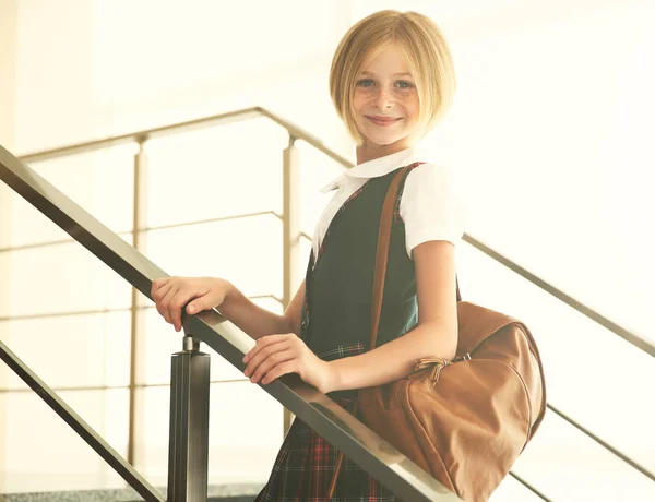 Cute schoolgirl on staircases — Stock Photo, Image